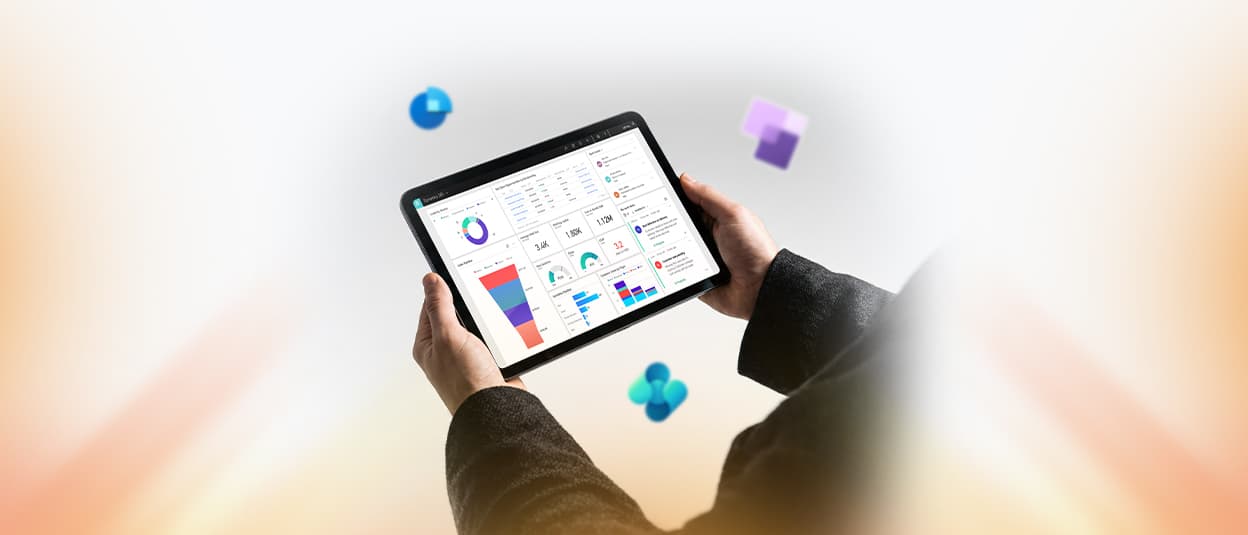 A Mazaya Smart Systems professional displaying business analytics dashboards on a tablet as part of Microsoft Dynamics 365 consulting and implementation services.